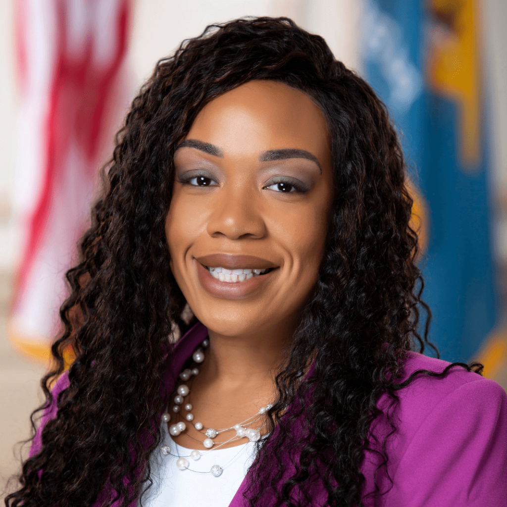 Portrait of Representative Melissa Minor-Brown with American and Delaware flags in the background